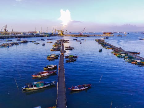 Aerial top down on traditional colourful asian fisherman boats moored in Gresik, Indonesia. Drone Photography. Aerial Photography.