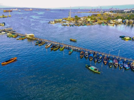 Aerial top down on traditional colourful asian fisherman boats moored in Gresik, Indonesia. Drone Photography. Aerial Photography.