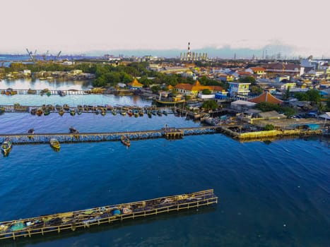 Aerial top down on traditional colourful asian fisherman boats moored in Gresik, Indonesia. Drone Photography. Aerial Photography.