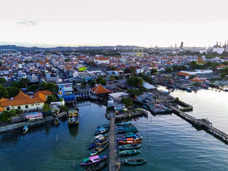 Aerial top down on traditional colourful asian fisherman boats moored in Gresik, Indonesia. Drone Photography. Aerial Photography.