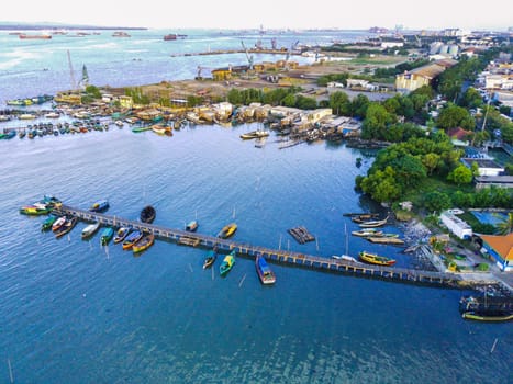 Aerial top down on traditional colourful asian fisherman boats moored in Gresik, Indonesia. Drone Photography. Aerial Photography.