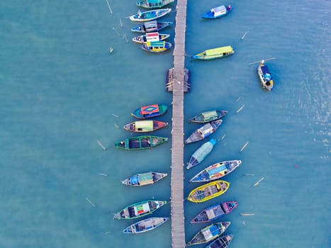 Aerial top down on traditional colourful asian fisherman boats moored in Gresik, Indonesia. Drone Photography. Aerial Photography.