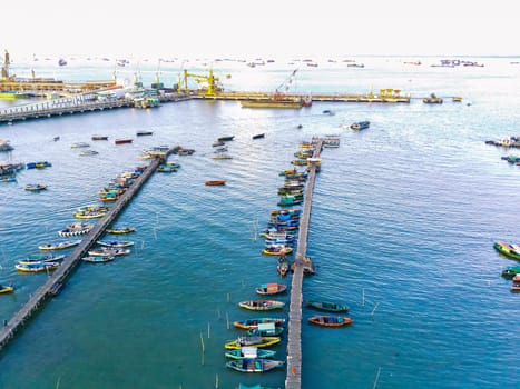Aerial top down on traditional colourful asian fisherman boats moored in Gresik, Indonesia. Drone Photography. Aerial Photography.