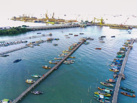 Aerial top down on traditional colourful asian fisherman boats moored in Gresik, Indonesia. Drone Photography. Aerial Photography.