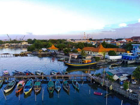Aerial top down on traditional colourful asian fisherman boats moored in Gresik, Indonesia. Drone Photography. Aerial Photography.