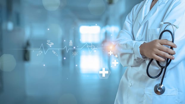 Medicine doctor with stethoscope in hand on hospital background. Medical technology. Healthcare and Medical concept.