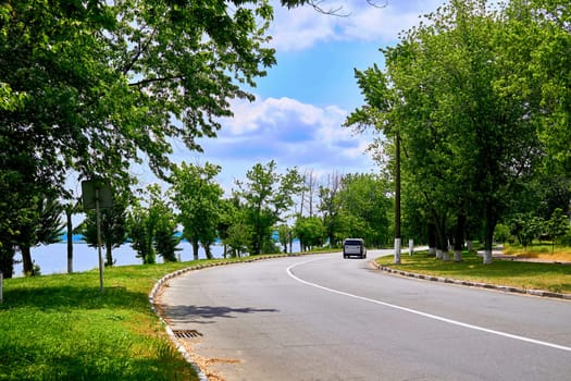 a wide way leading from one place to another, especially one with a specially prepared surface which vehicles can use