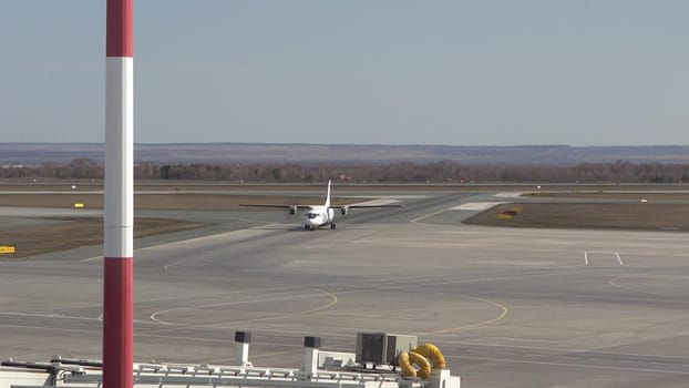 The plane has landed on the runway and is moving along the runway. International Airport. 4k