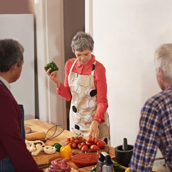 Lets make something healthy and hearty. a woman instructing a cooking class