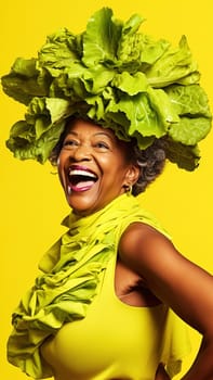 Adult African American woman smiling in a photo studio wearing a yellow dress with lettuce leaves on a yellow background. Generative AI. High quality photo