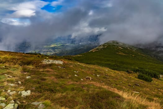 Beautiful cloudy green landscape around Sniezka mountain in Giant mountains