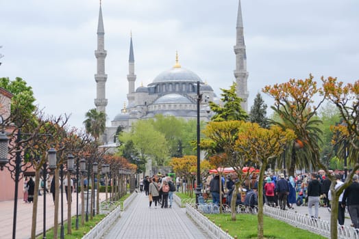 Istanbul, Turkey, May 02, 2023: Tourists admire the Blue Mosque,Sultan Ahmet Mosque. Architectural element of Muslim architecture.