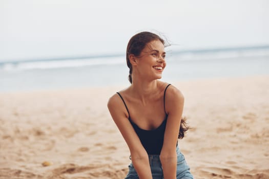 beach woman white view ocean young coast female smile beauty fashion sand happy vacation travel sitting carefree freedom body back sea nature