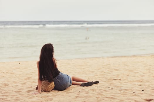 travel woman bali hair alone water vacation beach tropical female sand smile sea happy sitting fashion nature person freedom lifestyle attractive