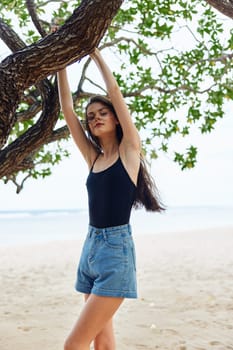 playing woman summer paradise nature alone beauty tree vacation sky relaxation smiling looking relax hanging leisure sea young horizon sitting lifestyle