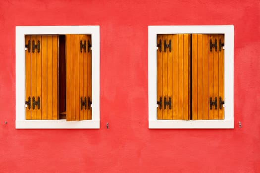 Windows of one of the characteristic colored houses of Burano (Venice)