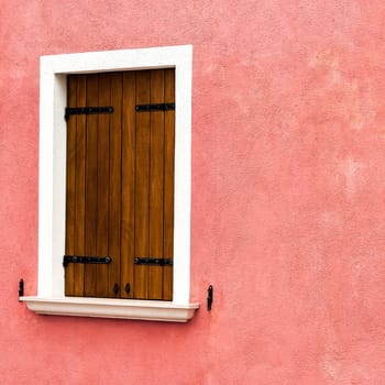 Window of one of the characteristic colored houses of Burano (Venice)