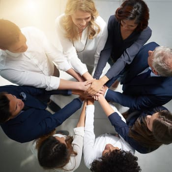 Hands together, support and business people in team with top view, solidarity and trust with professional community. Diversity, collaboration and corporate group in meeting with goals and commitment.