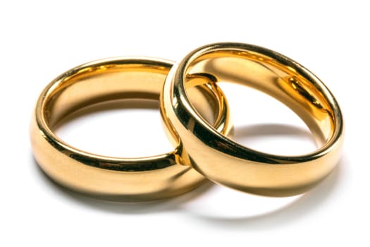 Golden wedding rings isolated on the white background