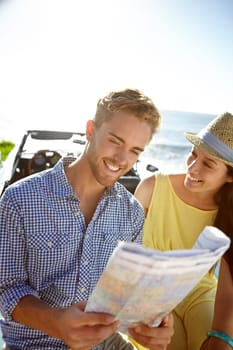 Adventure, road trip and couple with map by car on summer holiday, vacation and weekend getaway by ocean. Travelling, freedom and man and woman reading paper for directions, navigation and journey.