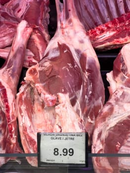 Raw lamb meat on the ribs lies in the supermarket. High quality photo