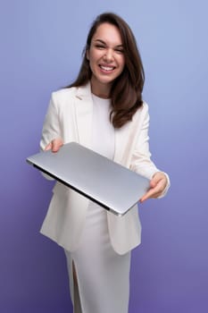 successful brunette business woman holding laptop computer for work.