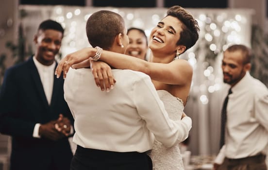 Wedding, diversity and dance with a lesbian couple in celebration of their union together at a ceremony of tradition. LGBT, woman or love with a female and partner dancing after being married.