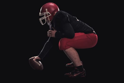 Soccer player on a dark background in vintage style. The classic American game. college Students. player game first before the attack