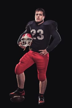 Soccer player on a dark background in vintage style. The classic American game. college Students