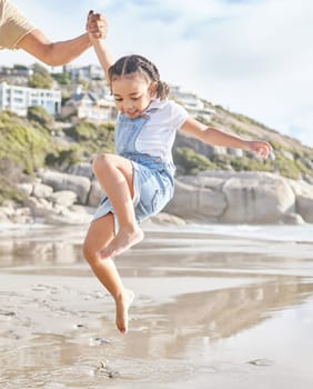 Summer, family and girl at the beach with arm of dad lifting her in water, having fun and bonding on travel vacation. Love, happy and ocean wave by child and parent playing in sea, happy and relax.