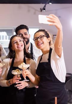 Students in cookery class taking selfie after cooking - friends and social media