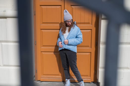 Portrait of a stylish woman in blue jacket. Spring outdoor portrait.