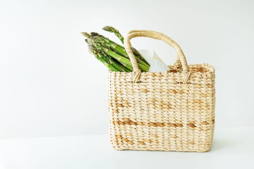 Fresh sliced asparagus on a white background. View from above. Vegan and very healthy healthy food. Farmer's harvest, going to the market