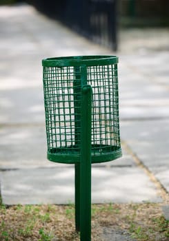 Empty trash can on city street