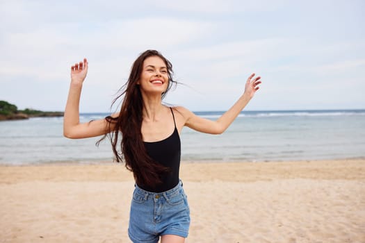 woman smile active young space sunset smiling sand nature tan running beach leisure lifestyle summer sea copy bikini happiness travel beautiful female