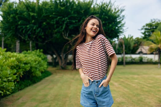 t-shirt woman hair active park female summer beautiful bali sunny joy meditation smiling hipster young lifestyle portrait long freedom quiet nature walk