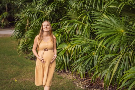 Pregnant woman walks in park at evening. Family enjoying pregnancy. The concept of Mother's Day and Women's Day.