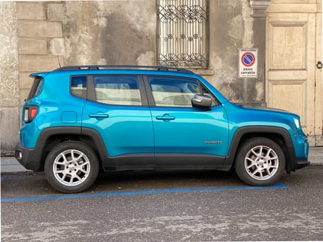Cremona , Italy- 17 February 2023 - indigo Jeep renegade parked in the street