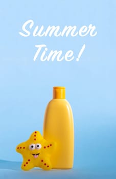 Yellow plastic bottle with baby cosmetic and funny toy. Sunscreen lotion. The concept of children's sun protection. Words Summer time. Vertical photo