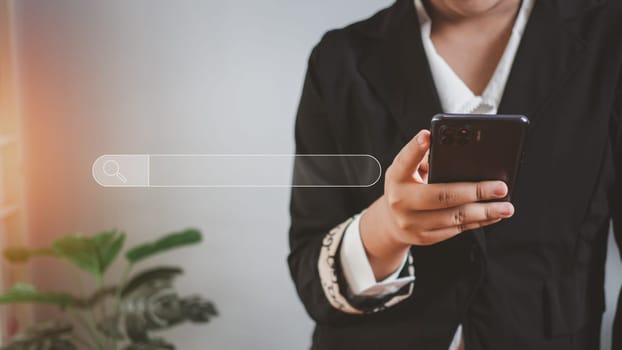 The concept of searching for information from the telephone network. Business woman standing and holding the phone with a search icon.