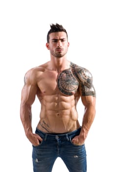 Handsome shirtless athletic man in jeans, with hands in his pockets,, looking at camera in studio shot, isolated on white background