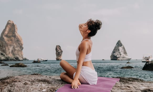 Fitness woman sea. Outdoor workout on yoga mat in park near to ocean beach. Female fitness pilates yoga routine concept. Healthy lifestyle. Happy fit woman exercising with rubber band in park.