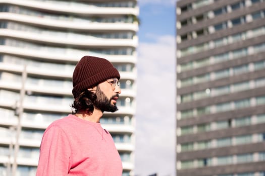 modern young man exploring city on sunny day, concept of street style and urban lifestyle, copy space for text
