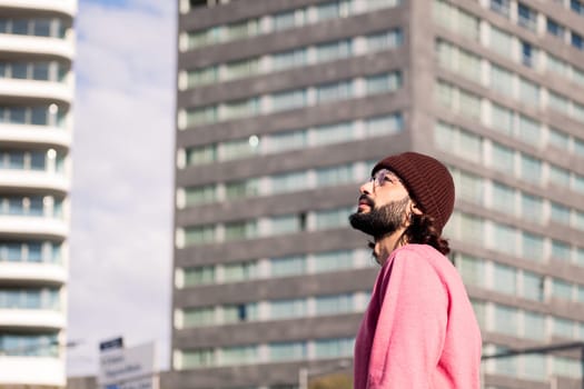 stylish young man exploring city on morning stroll, concept of street style and urban lifestyle, copy space for text