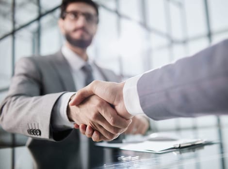 Handshake of two businessmen who enters into the contract to develop a new software