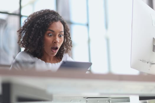 Confident businesswoman with digital tablet in office