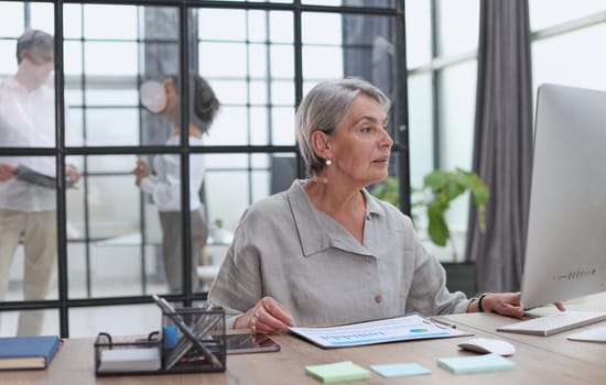 senior business woman gray hair tablet office happy mature businesswoman