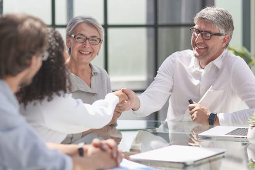 discussion of business people in the office sitting at the table