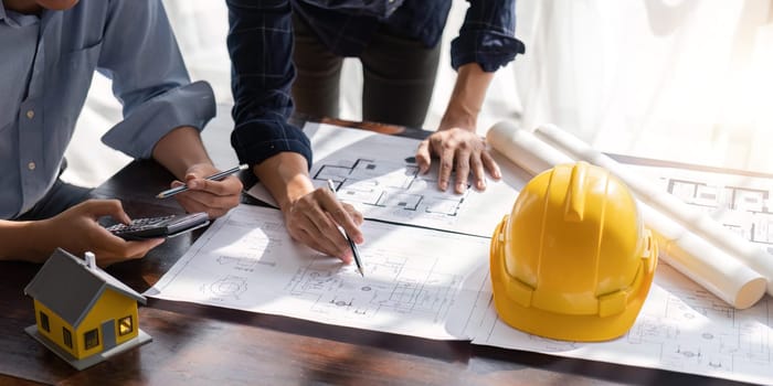 engineer team planning design house, modifying plan, creating construction project and addition according to customer requirement.