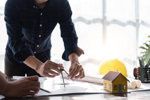 engineer team planning design house, modifying plan, creating construction project and addition according to customer requirement.